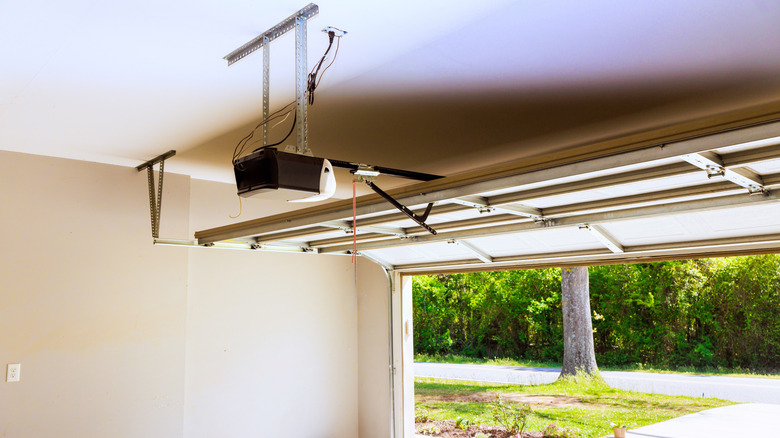 A smart garage door opener installed inside a garage