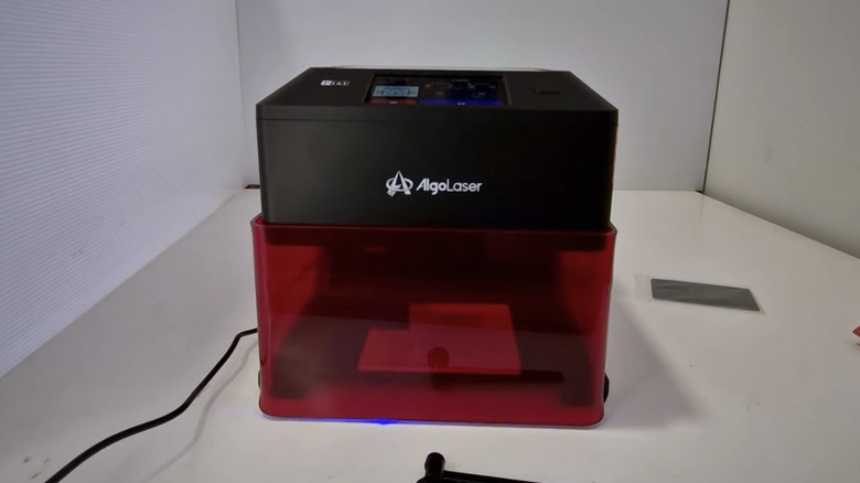 The AlgoLaser Pixi 5W Laser Engraver machine on a table