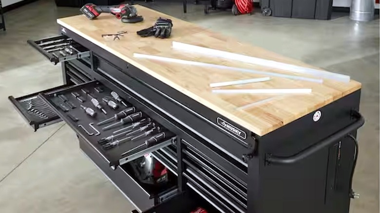 Husky tool chest holding tools in open drawers