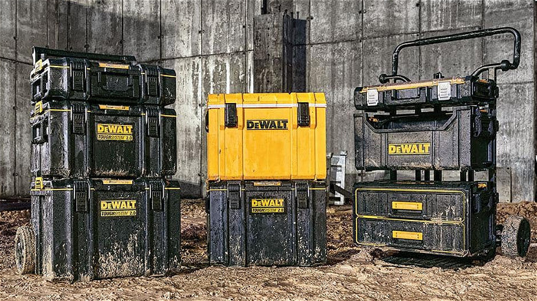 Various DeWalt ToughSystem toolboxes in mud.