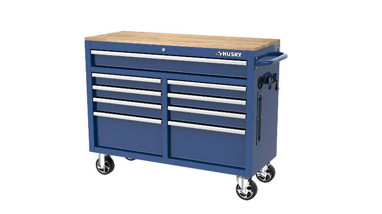 A blue Husky 9-Drawer Mobile Workbench on a white background.