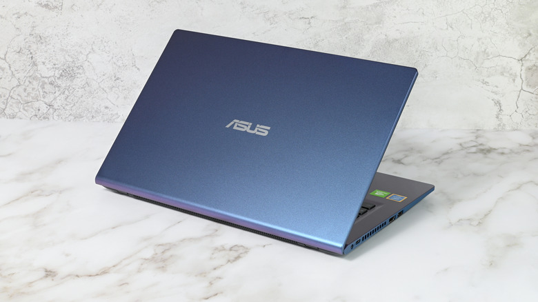 An ASUS laptop with placed against a whitish background