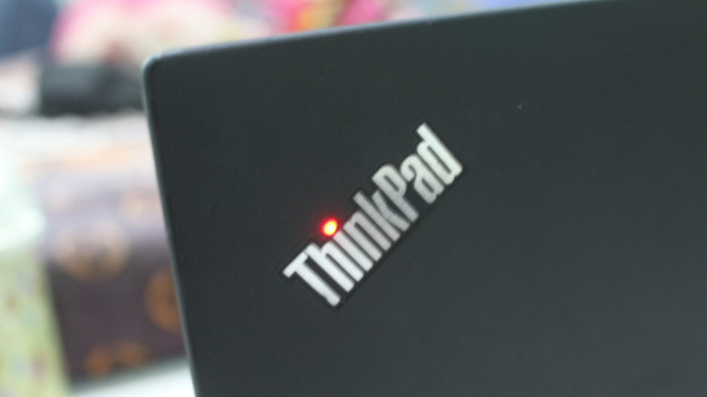 Front panel of the Lenovo ThinkPad laptop with its red light blinking