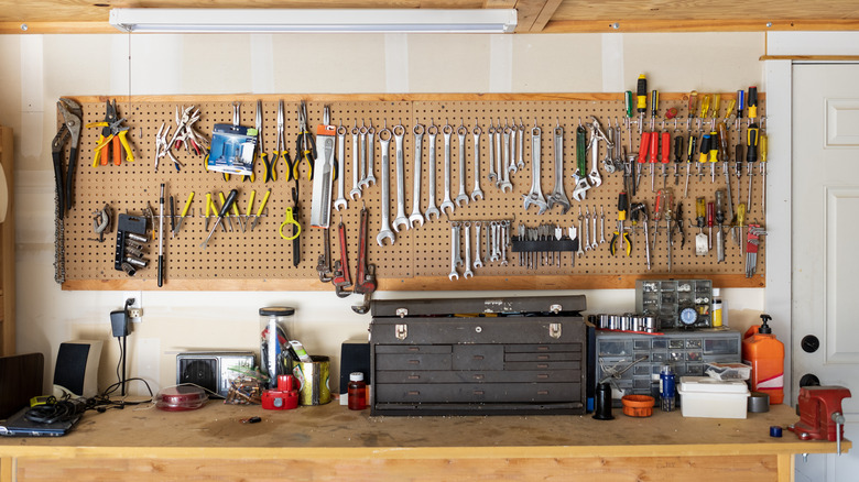 Pegboard on wall full of tools
