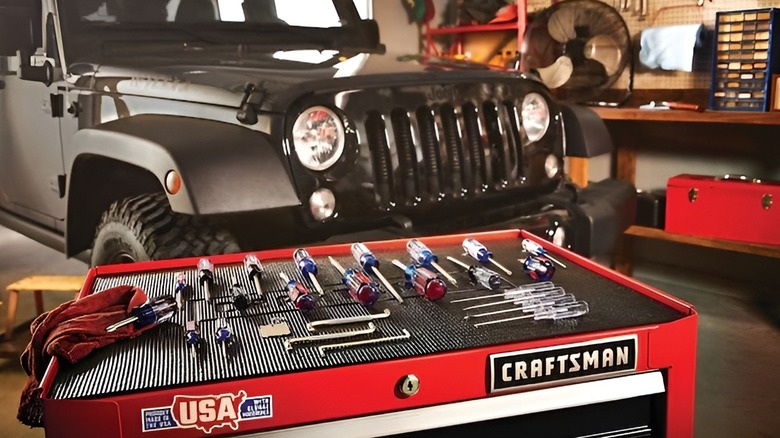 Craftsman screwdriver set on table in front of Jeep