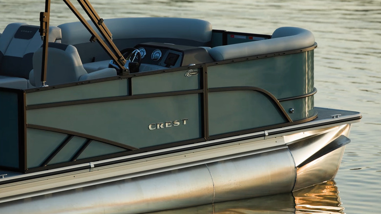 Crest pontoon boat on water
