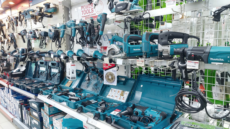 A large display of various Makita power tools in a store