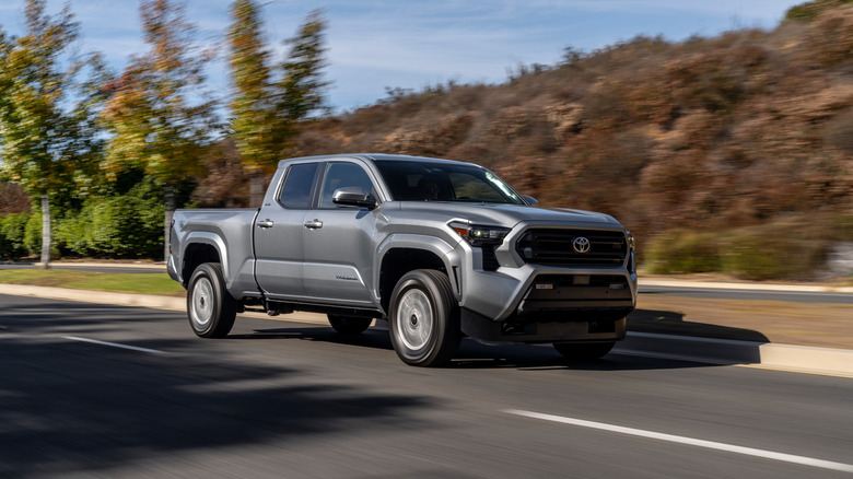 A gray 2026 Toyota Tacoma driving along on a highway