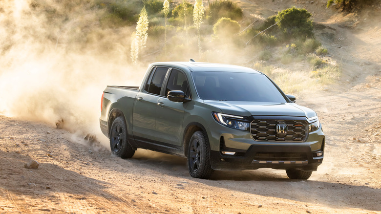 A 2026 Honda Ridgeline driving on a dusty trail