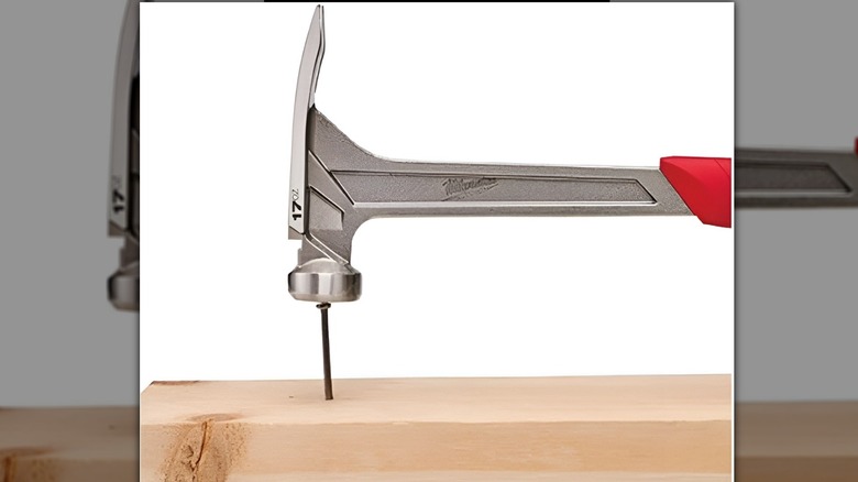 Milwaukee hammer hitting nail
