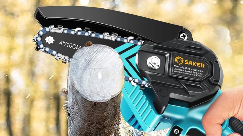 A person using a Saker mini chainsaw on a branch.