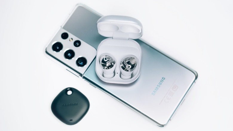 A silver Samsung Galaxy S21 Ultra with a few accessories