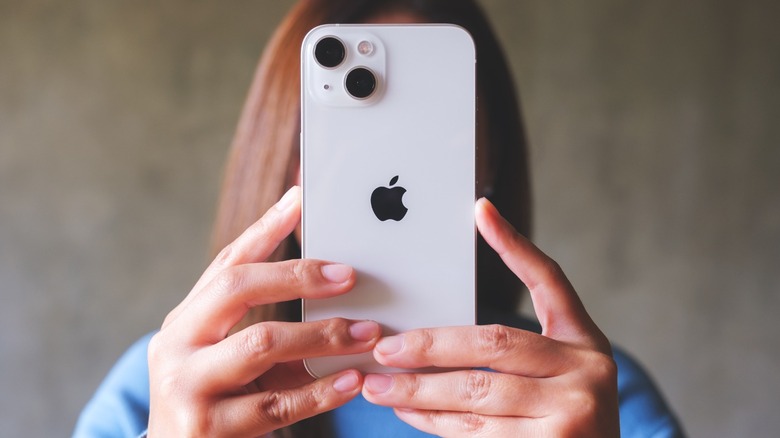 Woman holding iPhone
