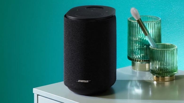 A Bose speaker on a table.