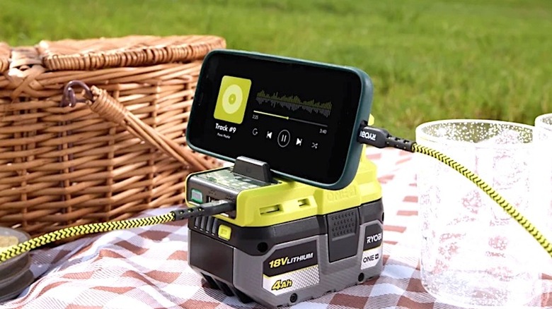 Ryobi 18V charger powering a mobile device and charging anohter