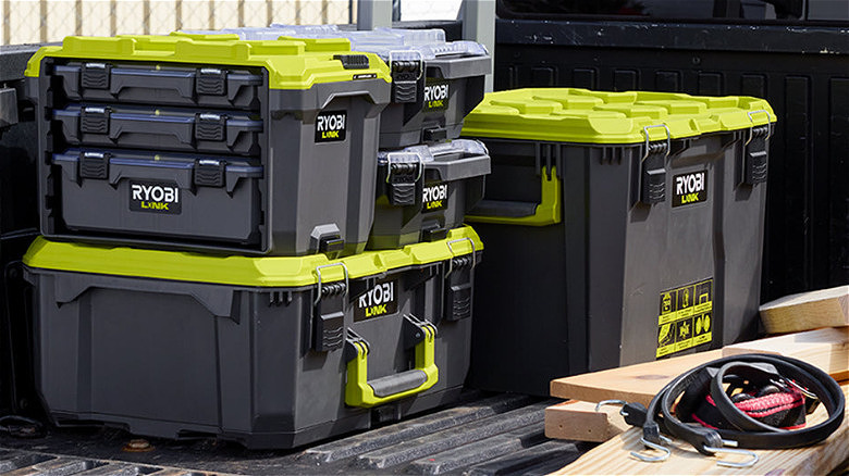 Three large Ryobi Link toolboxes and two smaller ones with on a pickup truck.