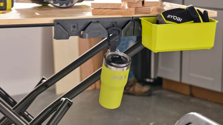 The Ryobi Steel Tumbler attached to a Ryobi Link Rail on a portable workbench.
