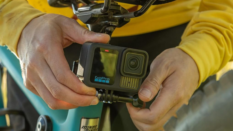 A man placing a GoPro HERO13 Black on his bike