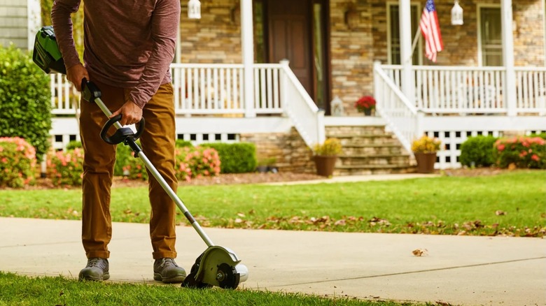 a person using a greenworks 80-volt gen 2 edger
