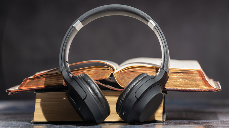 Headphones laying against books