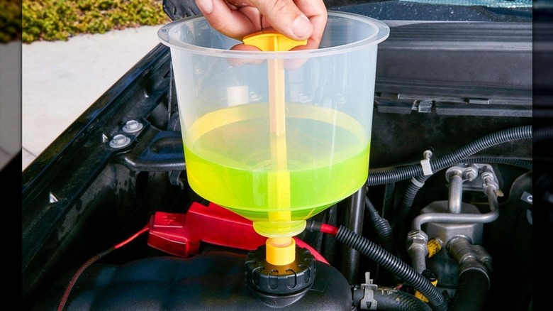 Close up of a radiator funnel kit in use
