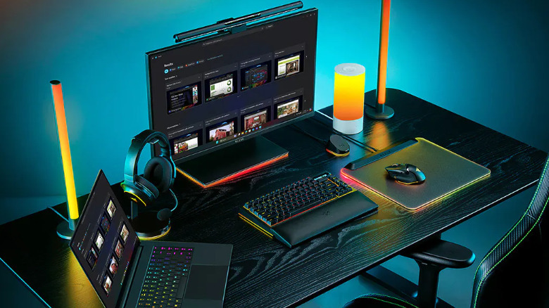 The Razer Blade 16 on a desk, connected to monitor, keyboard, and muose.