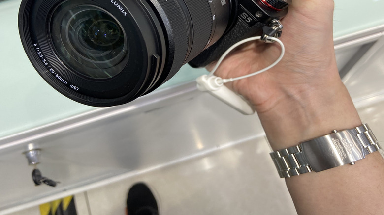 person holding a Panasonic Lumix S5 camera