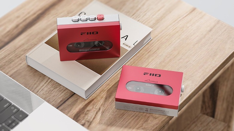 Top-down view of two red Fiio CP13s on a wood table
