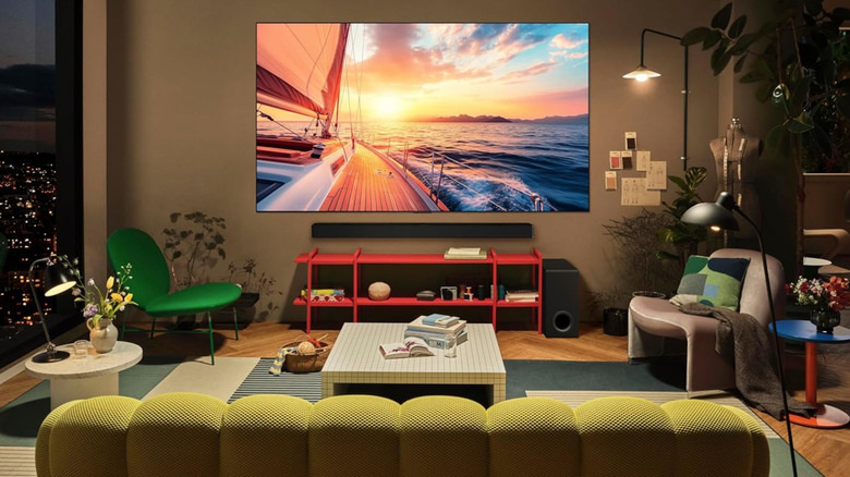 A setup of a room with LG OLED TV mounted on the wall