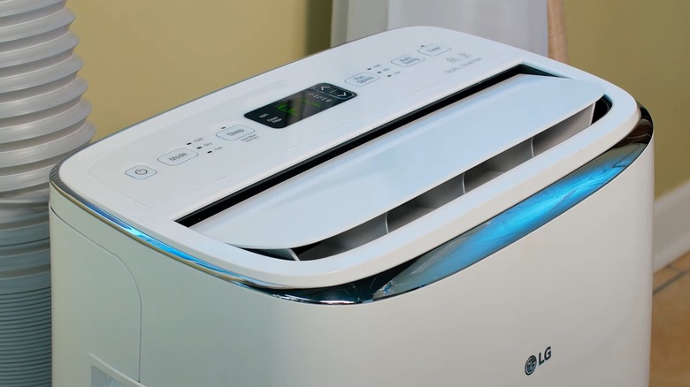 An LG portable air conditioner opening its top vent.