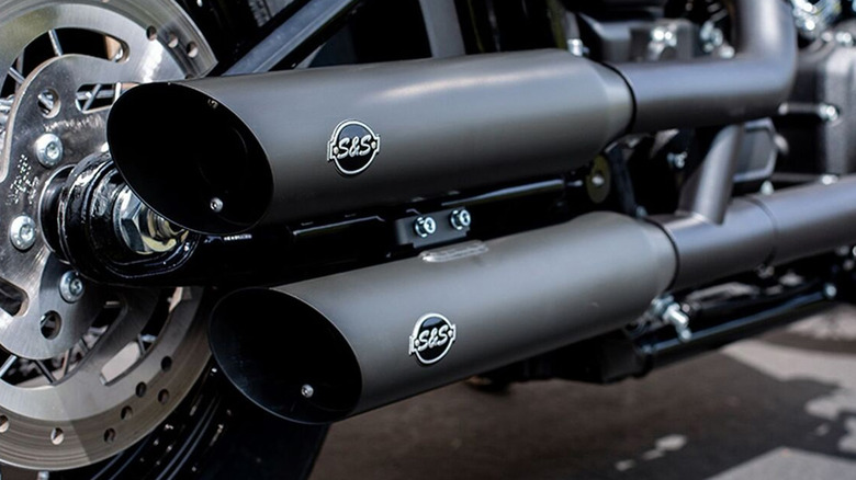 black S&S slip-on exhaust mounted on motorcycle