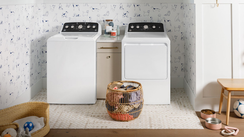 White GE washer and dryer in a modern laundry room