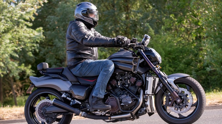 Motorcyclist riding a 2015 Yamaha VMax motorcycle on a British road