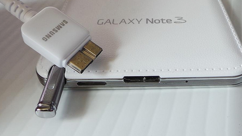 A Samsung USB 3.0 Micro-B cable alongside a Galaxy Note 3 device.