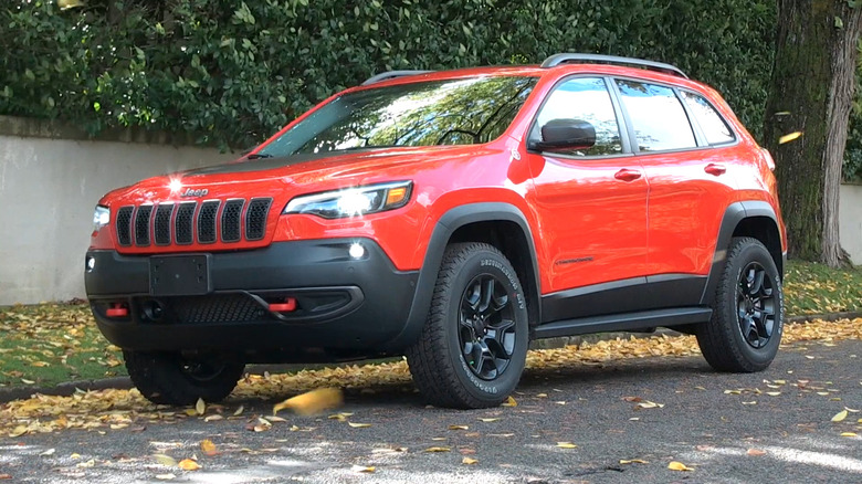 A red 2019 Jeep Cherokee parked on a street