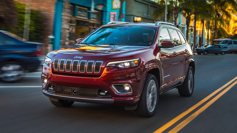 A red 2023 Jeep Cherokee driving