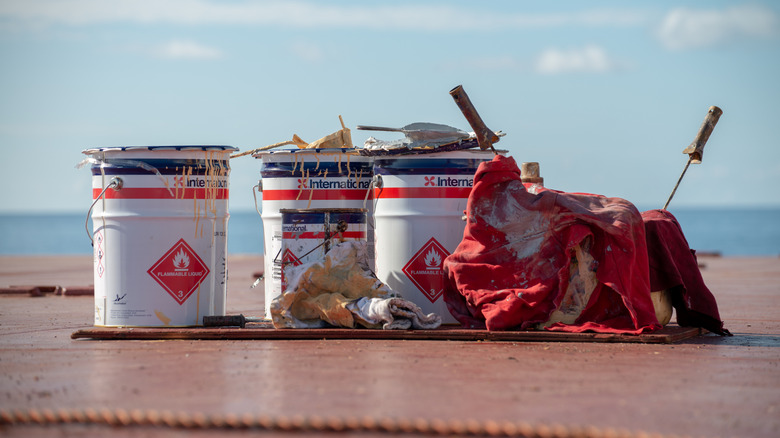 Picture shoing rags and flammable chemicals stored in the sun