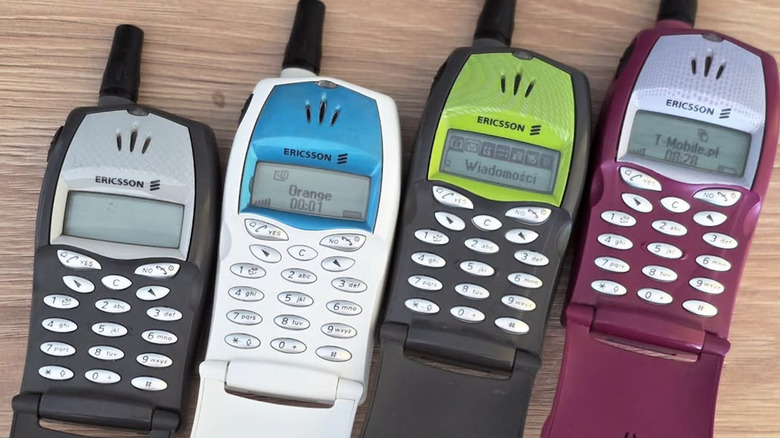 A lineup of Ericsson flip phones in various colors