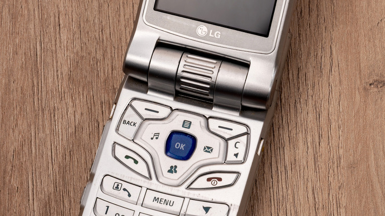 Close-up of a silver LG flip phone