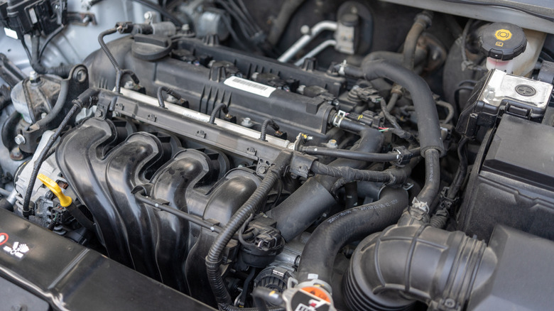 A vehicle's engine bay exposed.
