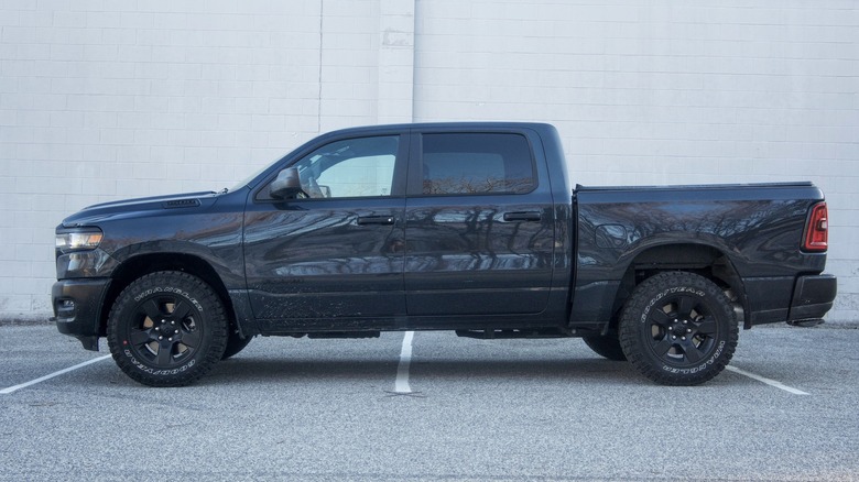 A black Ram 1500 Warlock parked side-on in a parking lot