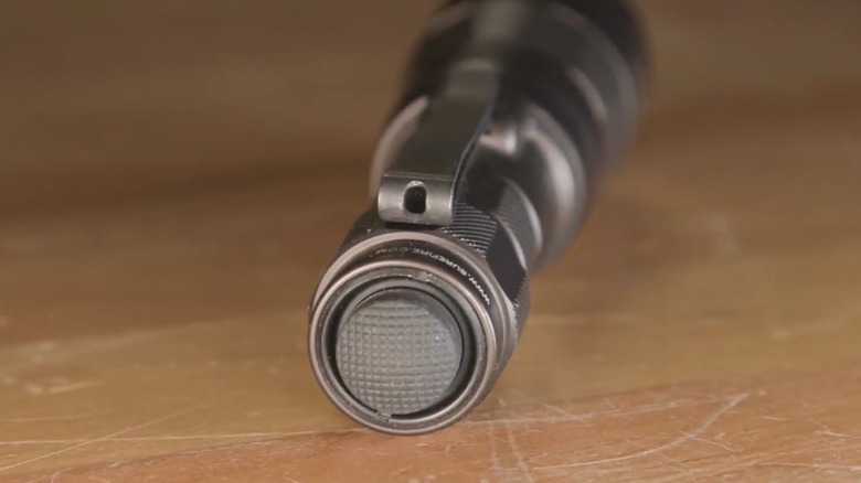 View of the tip of a SureFire flashlight.