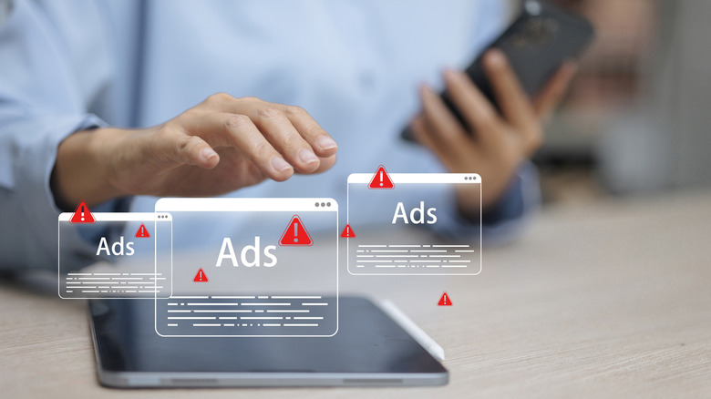 A graphic of pop up ads appearing on a tablet screen.