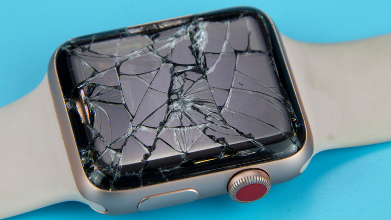 An Apple Watch with a cracked screen