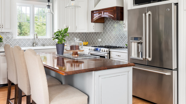 A modern kitchen with a stainless steel GE French door refrigerator