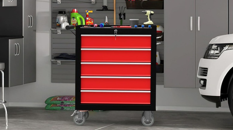 A red and black Dusacom rolling tool chest