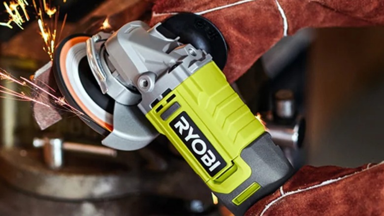 Person grinding steel with Ryobi One+ 18V HP Brushless 4 ½-inch Angle Grinder