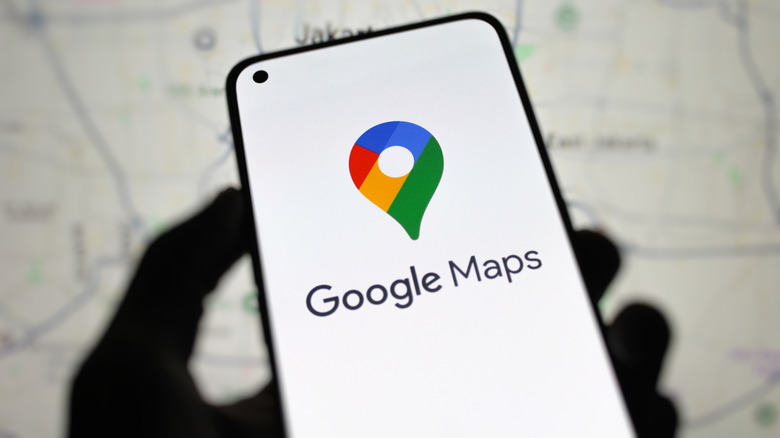 Google Maps logo on a smartphone.