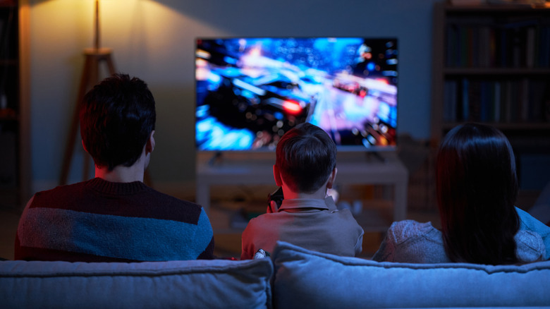 Video game on TV with family on couch