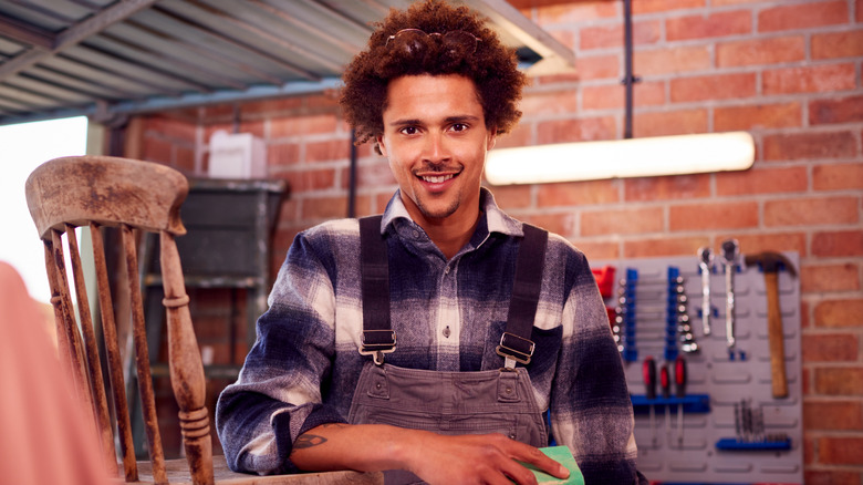 Happy person working in their garage